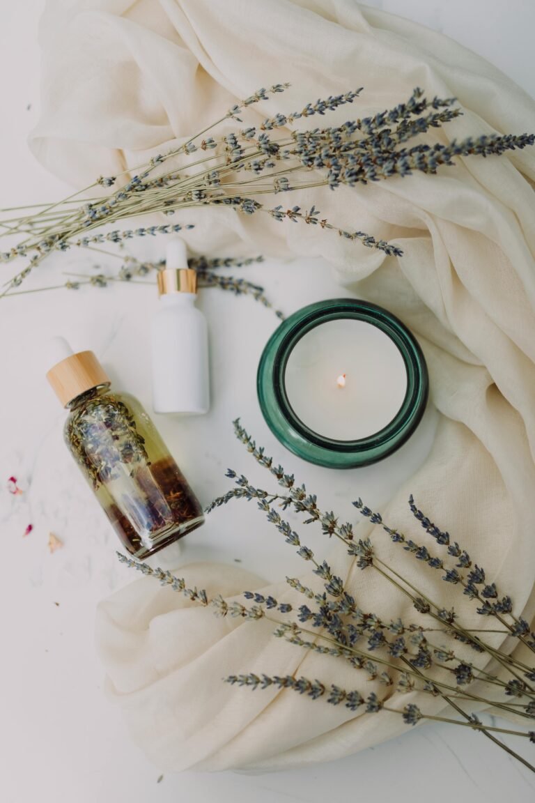 A calming flat lay of spa essentials featuring lavender and candles for relaxation.